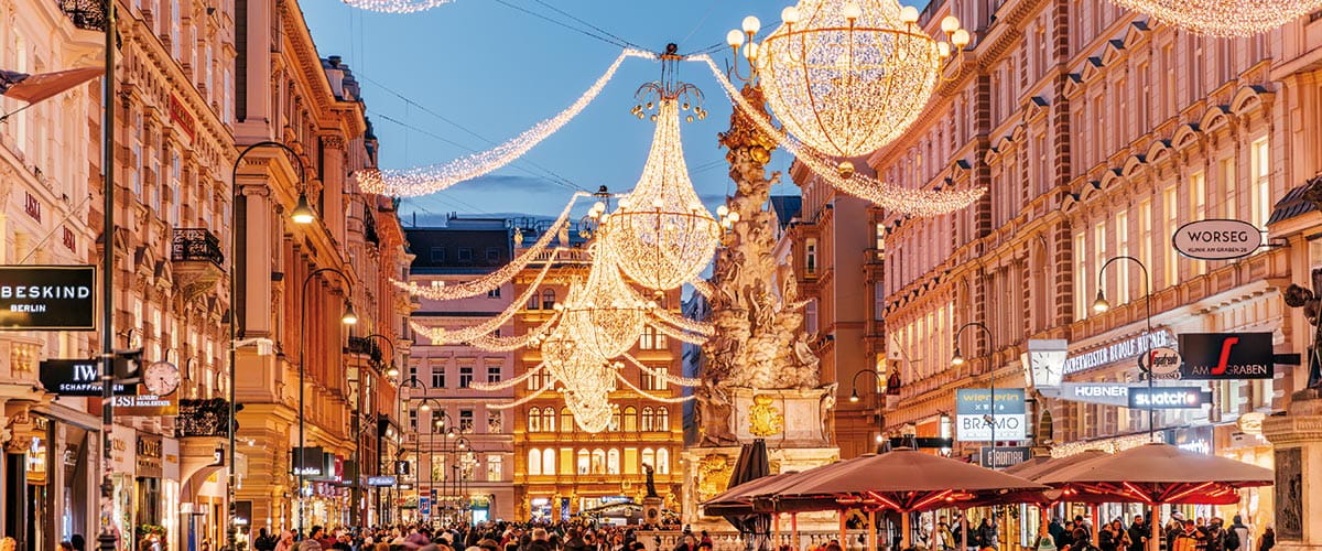 A view down a street in Vienna decorated with Christmas lights
